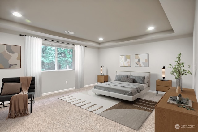 bedroom featuring a raised ceiling and carpet floors