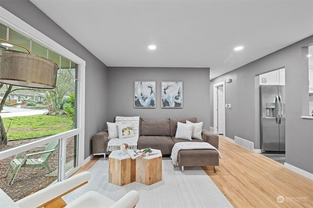 living room featuring light wood-type flooring