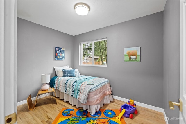 bedroom with hardwood / wood-style flooring