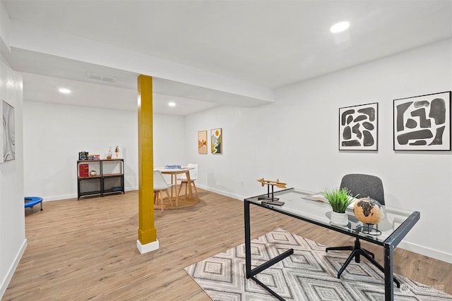 office with light wood-type flooring