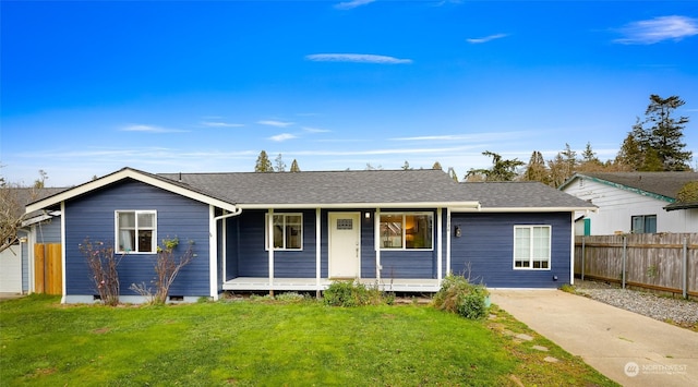 ranch-style house featuring a porch and a front yard