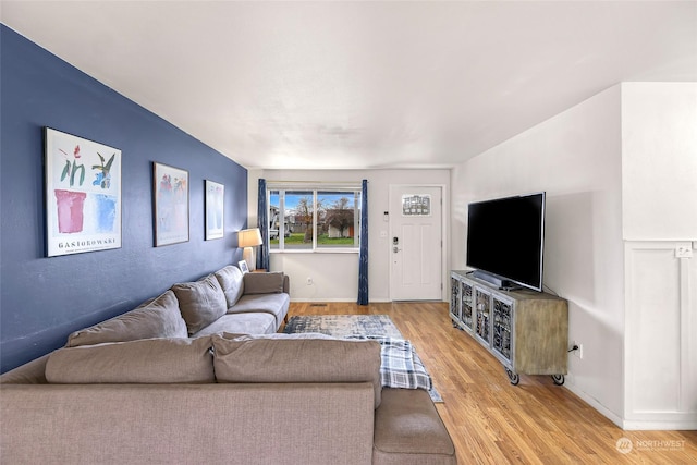 living room with light hardwood / wood-style flooring