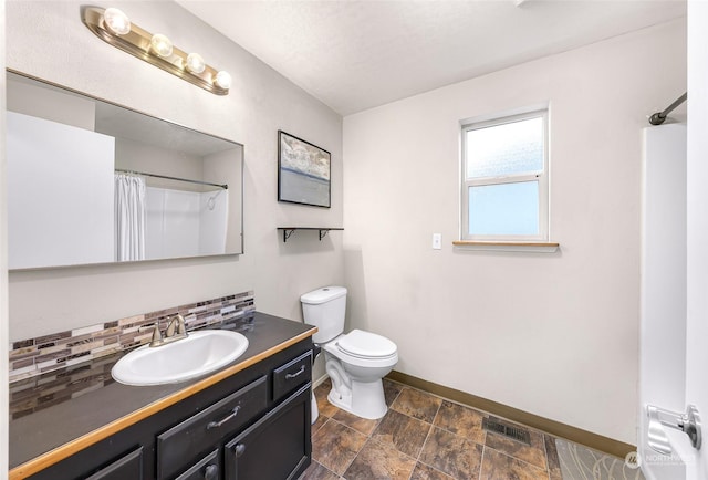 bathroom featuring decorative backsplash, a shower with curtain, vanity, and toilet