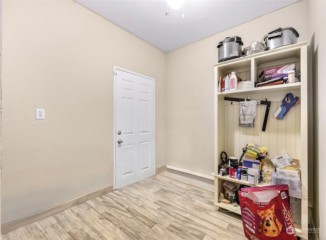 mudroom with light hardwood / wood-style floors