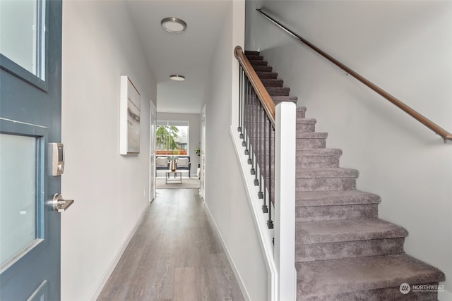 stairway featuring hardwood / wood-style floors