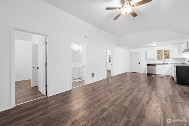 unfurnished living room featuring vaulted ceiling, ceiling fan, dark wood-type flooring, and sink