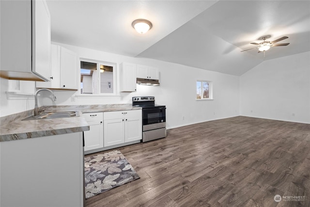 kitchen with lofted ceiling, stainless steel electric stove, sink, white cabinetry, and wood-type flooring