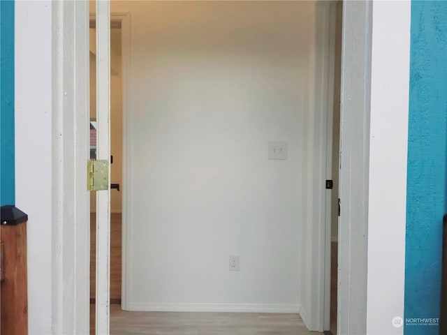 hall with light wood-type flooring