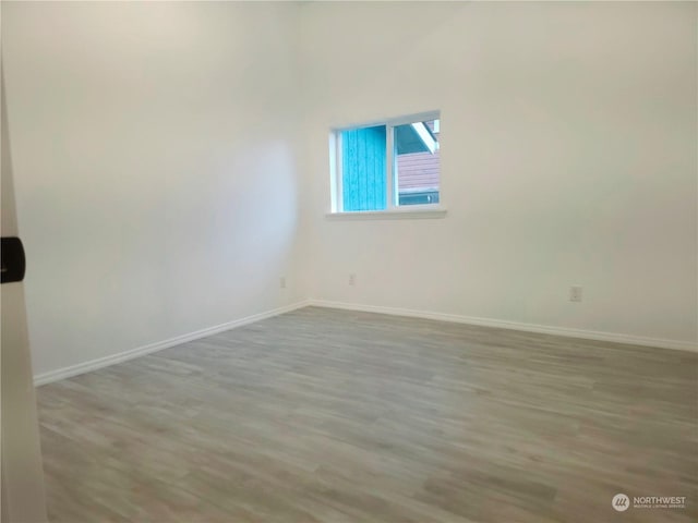 spare room featuring light hardwood / wood-style flooring