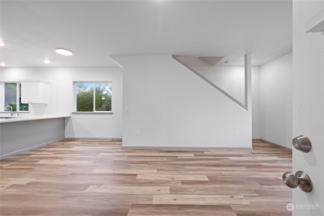 interior space with light wood-type flooring and sink