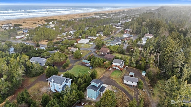 bird's eye view with a beach view and a water view