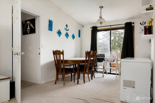 dining room with light carpet