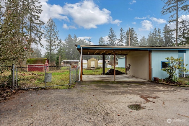 view of parking / parking lot featuring a carport