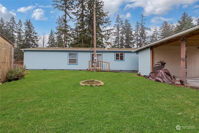 rear view of house with a lawn