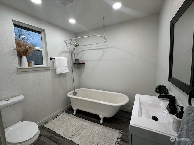 full bathroom featuring separate shower and tub, sink, hardwood / wood-style floors, and toilet