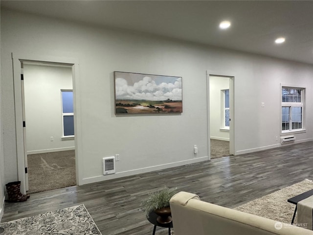 living room featuring dark hardwood / wood-style flooring