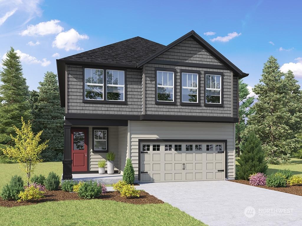 view of front facade featuring a front yard and a garage