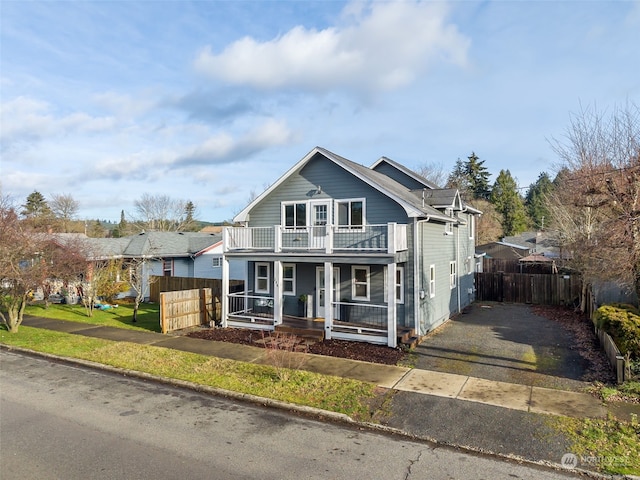 view of front of property with a balcony and a porch