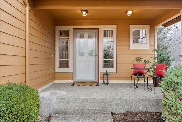 doorway to property with covered porch