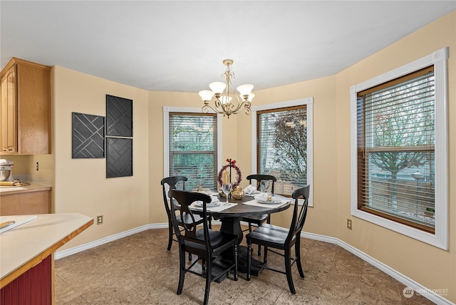 dining room featuring a wealth of natural light and a chandelier