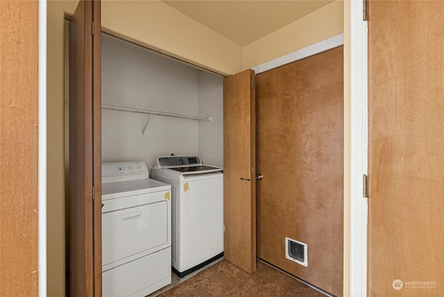 laundry area featuring separate washer and dryer