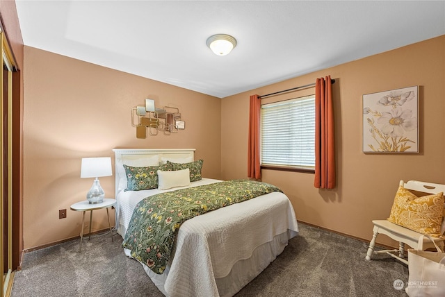 bedroom featuring dark carpet