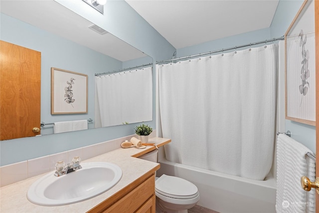 full bathroom with vanity, toilet, and shower / tub combo with curtain