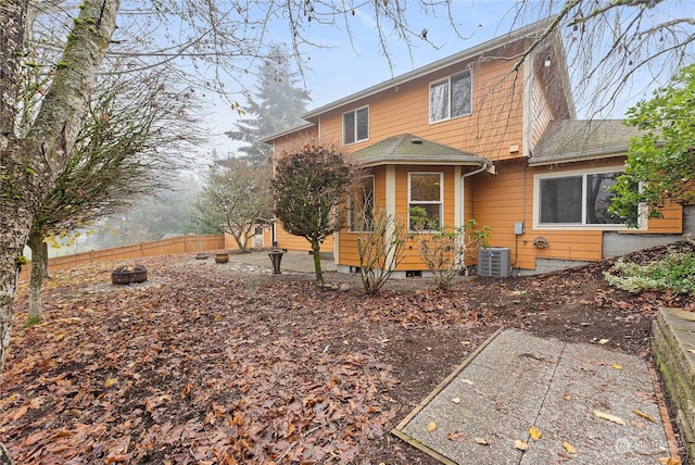 rear view of property featuring central air condition unit