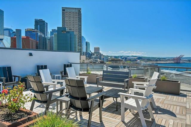 view of patio / terrace featuring a water view and a balcony