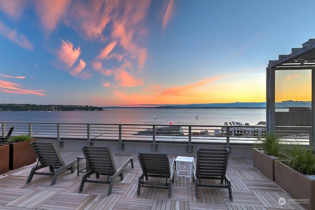 patio terrace at dusk with a water view