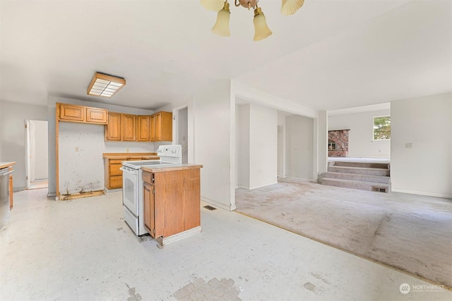 kitchen featuring a kitchen island and white electric range oven