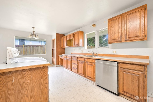 kitchen featuring dishwasher, hanging light fixtures, a notable chandelier, and sink