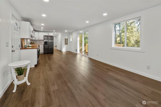 living room with dark hardwood / wood-style flooring and sink