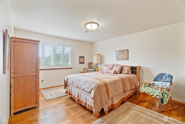 bedroom with light hardwood / wood-style flooring