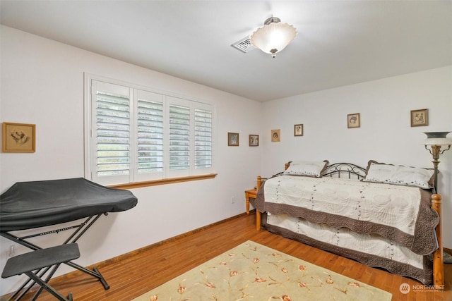 bedroom featuring wood-type flooring and billiards