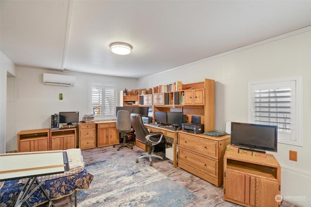 home office with crown molding, a wall mounted air conditioner, and light wood-type flooring