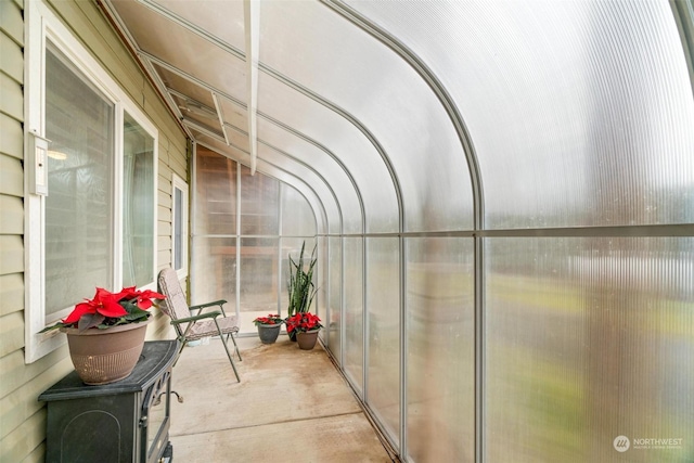 sunroom featuring lofted ceiling