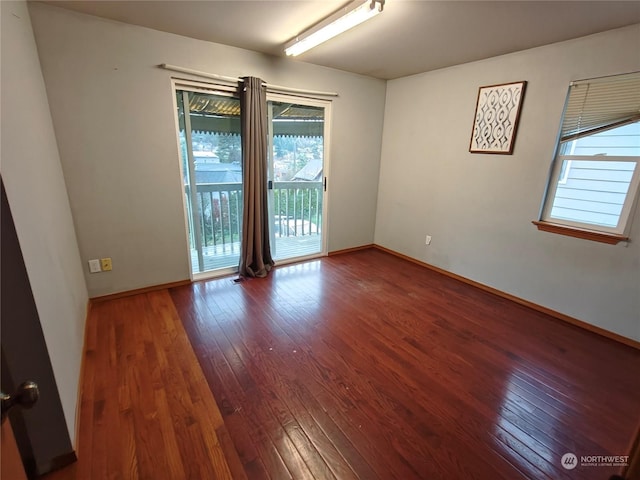 unfurnished room featuring hardwood / wood-style floors