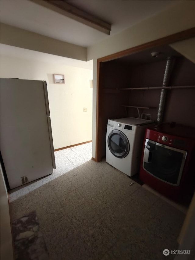 laundry room with washer and clothes dryer