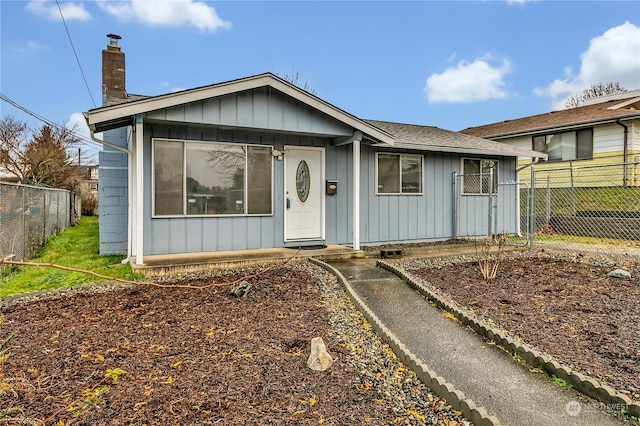 1675 S 57th St, Tacoma, WA 98408 - ranch-style house with a chimney and board and batten siding