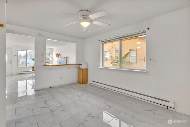1675 S 57th St, Tacoma, WA 98408 - empty room featuring a baseboard heating unit, light marble finish flooring, and ceiling fan
