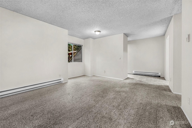 unfurnished room with a textured ceiling and baseboard heating