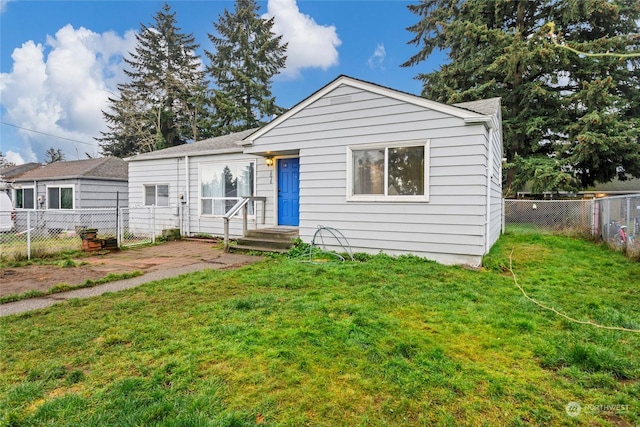 bungalow-style house with a front yard