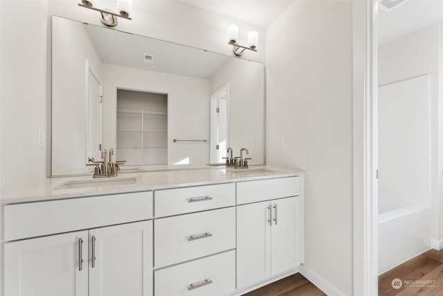 bathroom featuring vanity and hardwood / wood-style floors