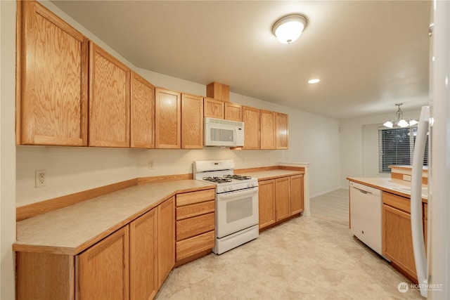 kitchen with light brown cabinets, white appliances, light colored carpet, and a notable chandelier