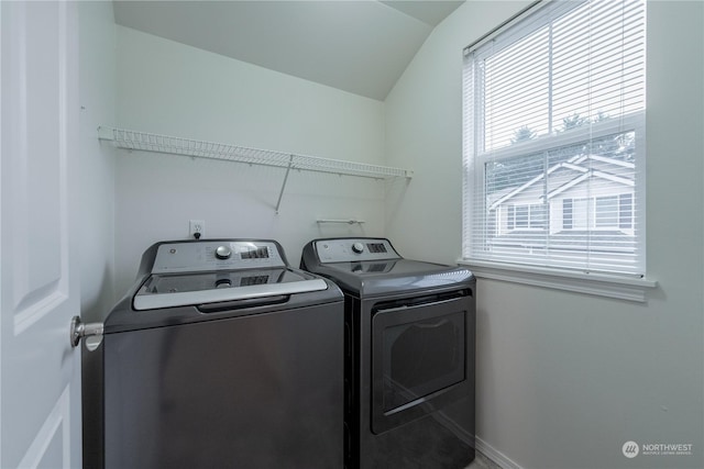 clothes washing area with washing machine and clothes dryer