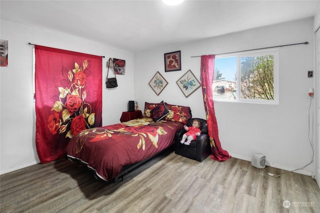 bedroom featuring wood-type flooring