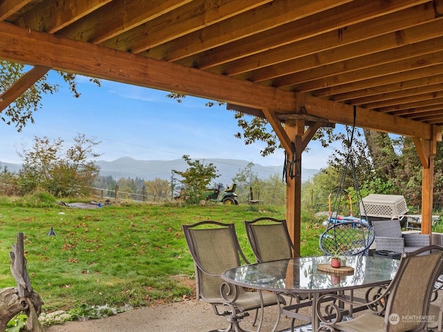 view of patio / terrace featuring a mountain view