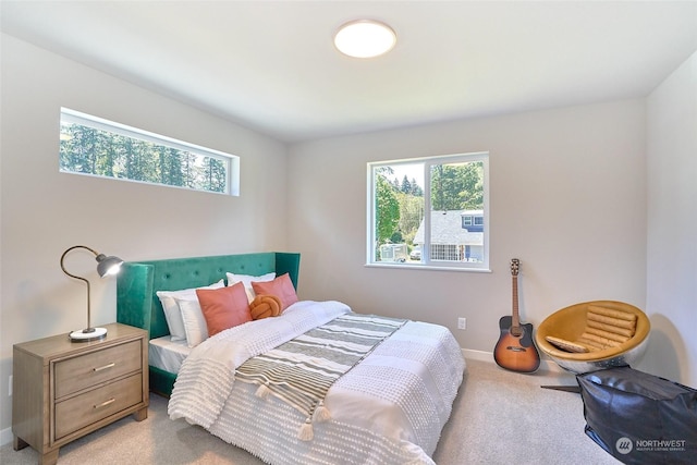 bedroom featuring light colored carpet