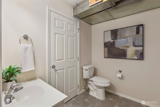 bathroom featuring sink and toilet